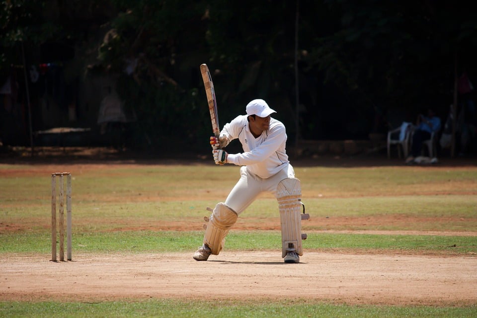 A Cricket Batsman Playing a Shot